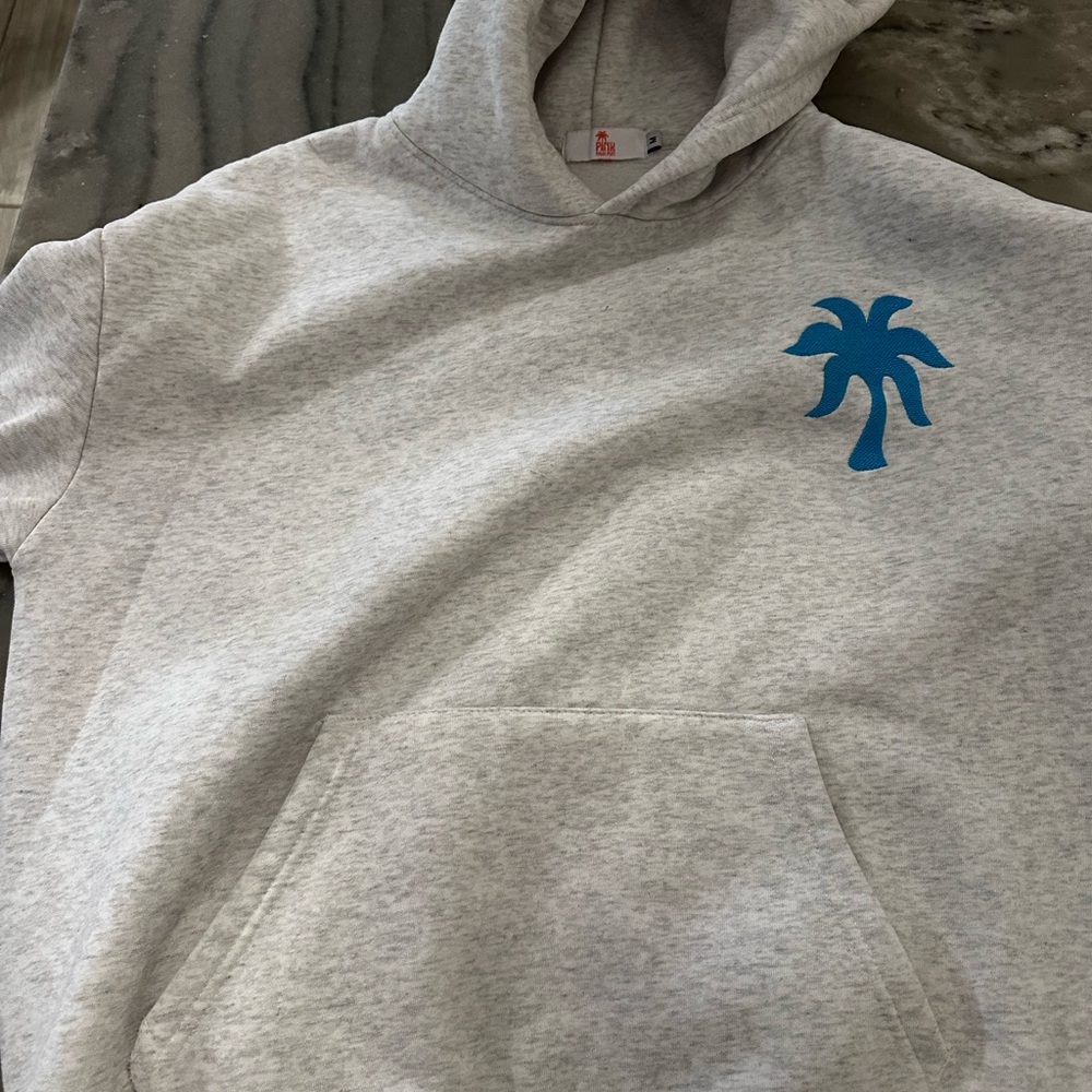 Gray Hoodie with Blue Palm Tree Design- does have one small stain on front-